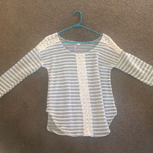 Francesca’s striped mid-length top.